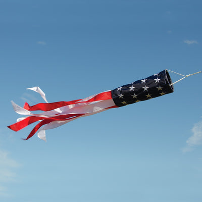 Embroidered Stars & Stripes 50' Value Windsock featuring the American flag design, displayed outdoors with colorful tails fluttering in the wind.