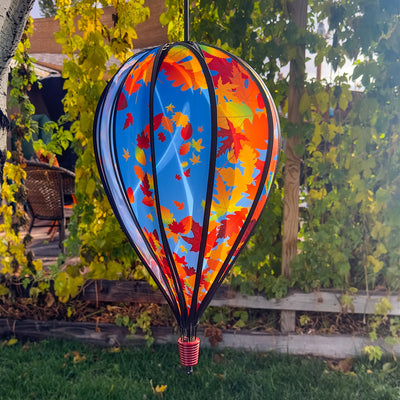Fall Leaves 10-Panel Hot Air Balloon Spinner featuring colorful autumn leaves in motion, perfect for outdoor decoration and seasonal festivities, hanging from a garden hook.