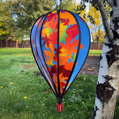 Fall Leaves 10-Panel Hot Air Balloon Spinner featuring colorful autumn leaves in motion, perfect for outdoor decoration and seasonal festivities, hanging from a garden hook.