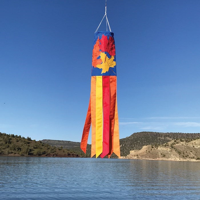 Fall Leaves 40-inch windsock featuring vibrant red, orange, and yellow leaves with color-coordinated tails, elegantly displayed outdoors.