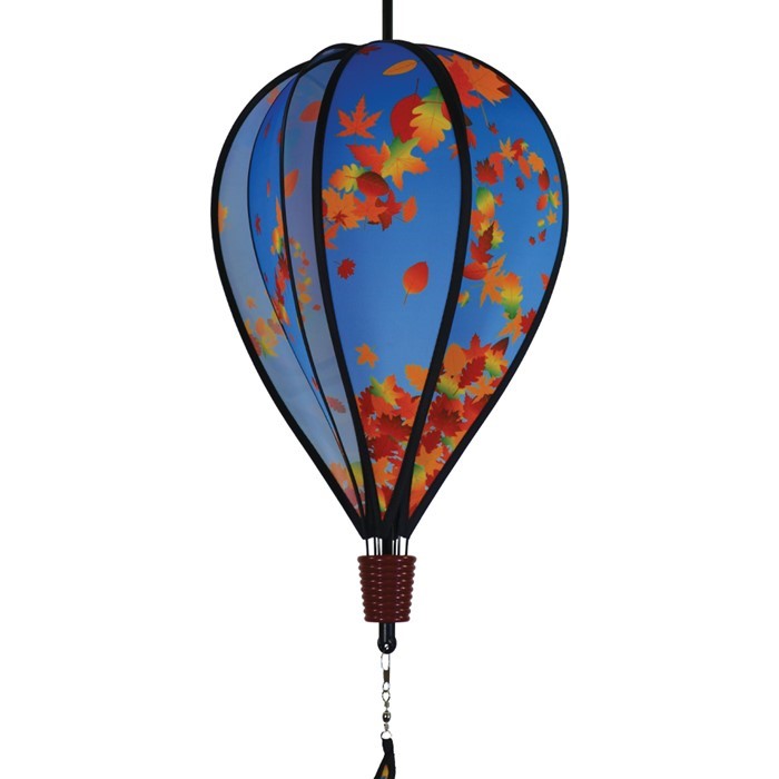 Colorful 6-panel hot air balloon spinner featuring falling autumn leaves, suspended in an outdoor garden setting, capturing the essence of fall.
