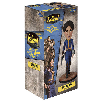 Fallout: Lucy MacLean Bobblehead standing proudly in a Vault 33 jumpsuit, ready for adventure with a rugged base reflecting the Wasteland.