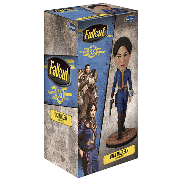 Fallout: Lucy MacLean Bobblehead standing proudly in a Vault 33 jumpsuit, ready for adventure with a rugged base reflecting the Wasteland.