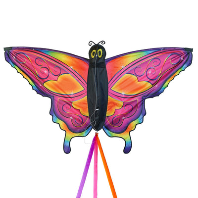 Brightly colored Fancy Butterfly Kite soaring in the sky, showcasing its vivid butterfly design and flowing tails during a sunny day.