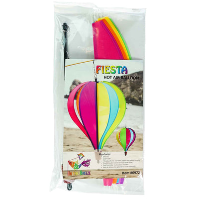 Colorful Fiesta 6-Panel Fabric Hot Air Balloon Spinner in a garden setting, highlighting its vibrant colors and balloon shape for outdoor decor.