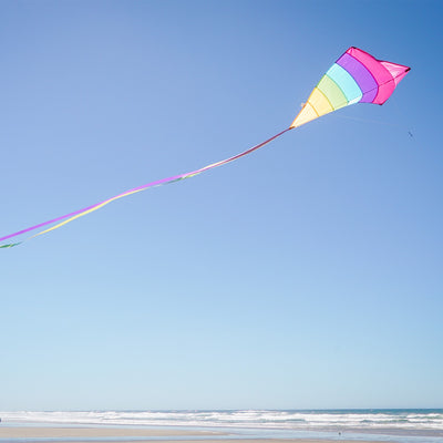 Fiesta Arch 39" Diamond Kite with colorful design flying high against a bright blue sky during outdoor family fun.