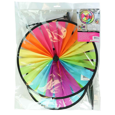 Fiesta Triple Wheel Spinner with three colorful wheels rotating in the breeze on a garden pole, showcasing a bright outdoor scene.