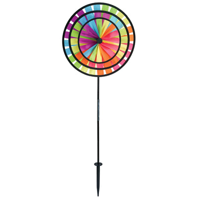 Fiesta Triple Wheel Spinner with three colorful wheels rotating in the breeze on a garden pole, showcasing a bright outdoor scene.