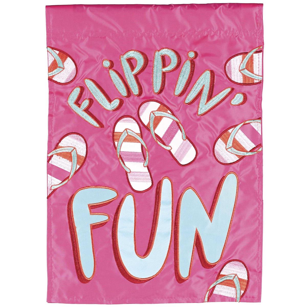 Flippin Fun double-sided garden flag featuring colorful fabric appliques and detailed embroidery displayed on a garden flagpole in a sunny outdoor setting.