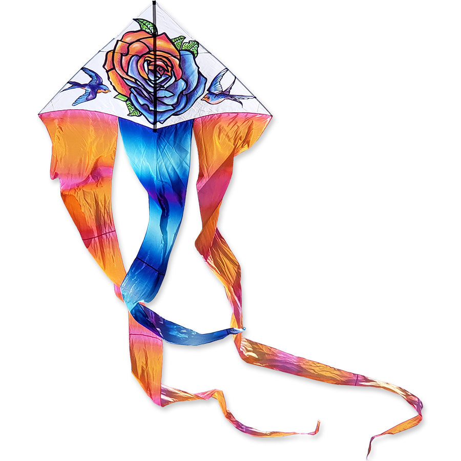 6.5 ft. Flo-Tail Delta Kite - Tattoo flying in clear blue skies, captivating viewers with its vibrant design and long flowing tails.