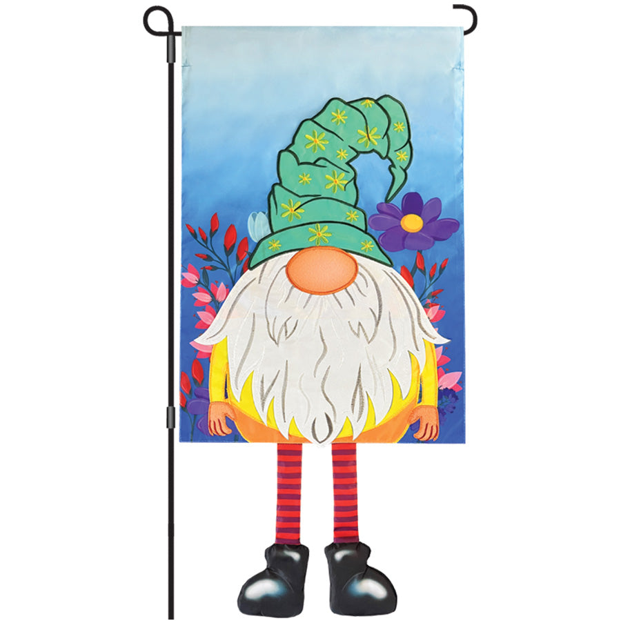 Colorful 13 in. Enhanced Flag - Flower Gnome with intricate embroidery displayed on a garden flag pole, surrounded by blooming flowers.