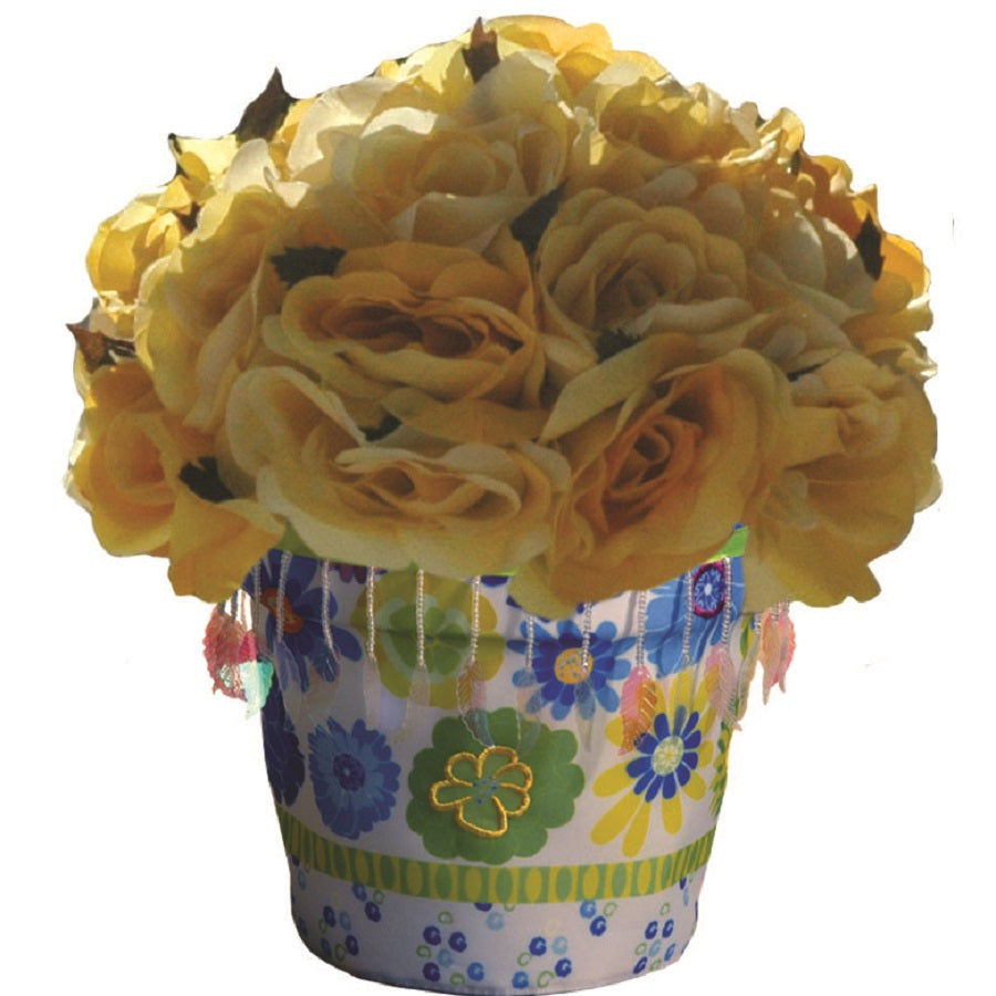 Flower Pot Cover - Garden Blooms featuring colorful floral designs, elegantly displayed over a standard indoor flower pot in a stylish setting.