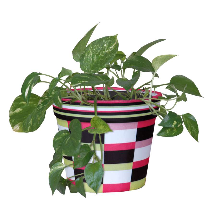 Pink Deco Flower Pot Cover designed for indoor plants, featuring a charming floral pattern to enhance decor in a home setting.