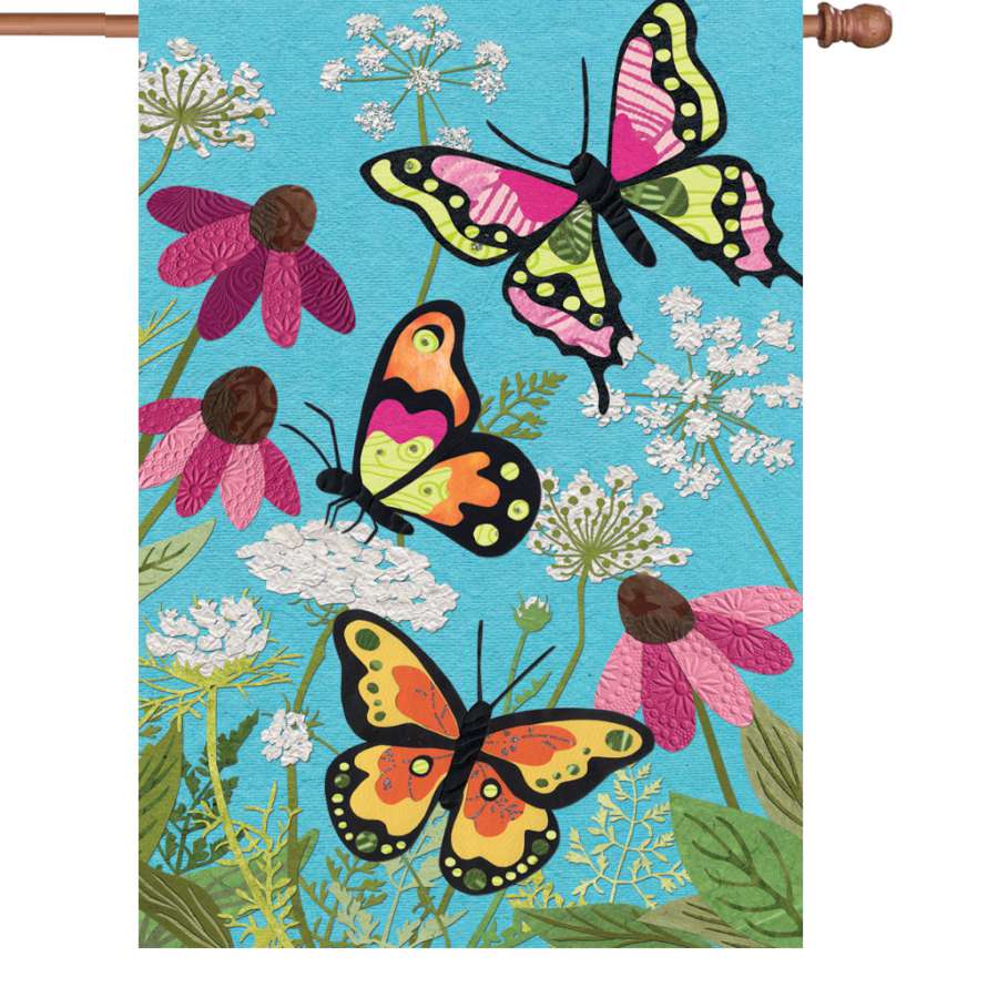 28 in. Fluttering Butterflies garden flag displaying colorful butterfly designs on a flagpole in a sunny outdoor setting.