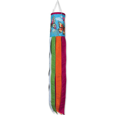 A vibrant Fluttering Butterflies windsock in traditional shape, showcasing colorful butterfly designs, gracefully fluttering in the breeze against a blue sky.