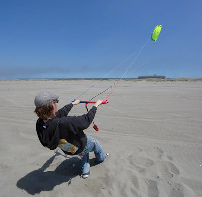 Three-line traction kite with water-relaunchable design, advanced control features, and smooth power delivery for land and water adventures.