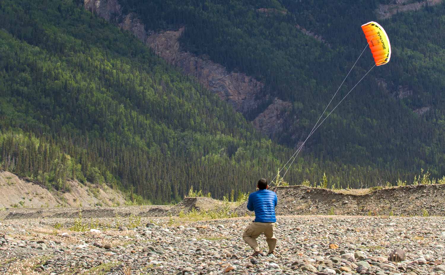 Synapse 170 dual-line stunt kite with frameless fabric sail, 66.5-inch wingspan, and ultra low-stretch Dyneema flying lines in a ready-to-fly package.