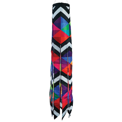 Geometric Black & White 40-inch Illusion Windsock hanging in a garden, featuring embroidered details and stunning printed tails creating a mesmerizing effect.