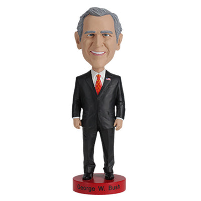 Detailed George W. Bush bobblehead with realistic facial features and vibrant colors, set on a display shelf against a neutral background.