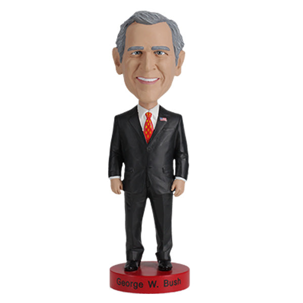 Detailed George W. Bush bobblehead with realistic facial features and vibrant colors, set on a display shelf against a neutral background.