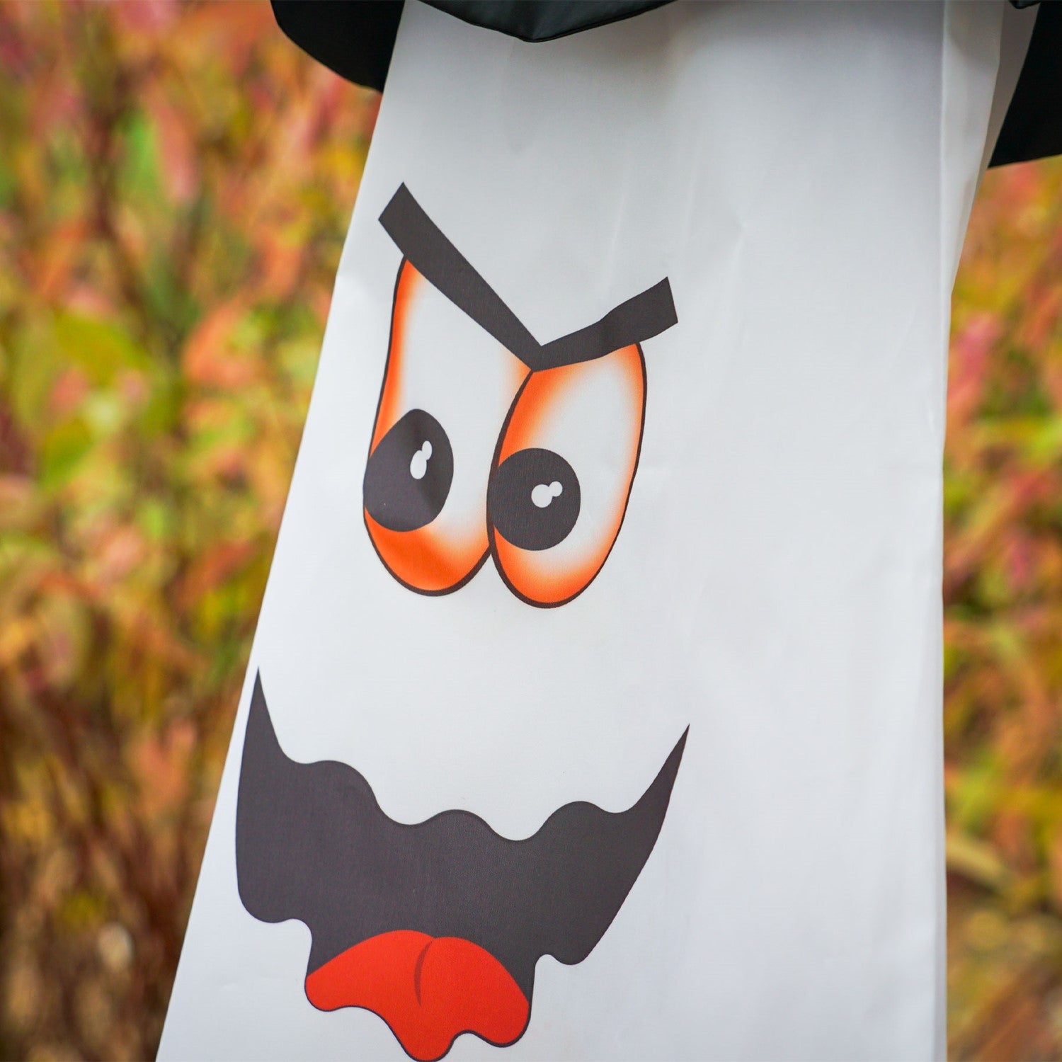 Ghost 3D Cone Windsock with a smiling ghost design and buckled hat, gracefully hanging in the breeze as part of colorful Halloween decorations.