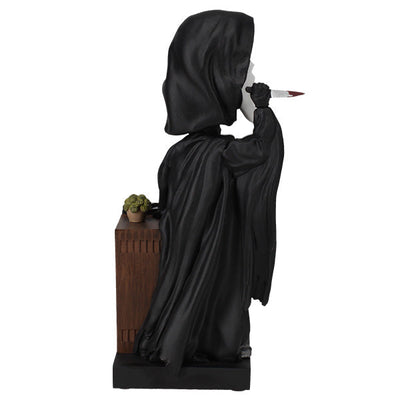 Ghost Face Bobblescape Bobblehead depicting Ghost Face with a bloodied knife, accompanied by a vintage tube TV displaying "Ghost Face Lives" for horror fans.