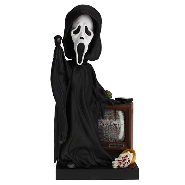 Ghost Face Bobblescape Bobblehead depicting Ghost Face with a bloodied knife, accompanied by a vintage tube TV displaying "Ghost Face Lives" for horror fans.