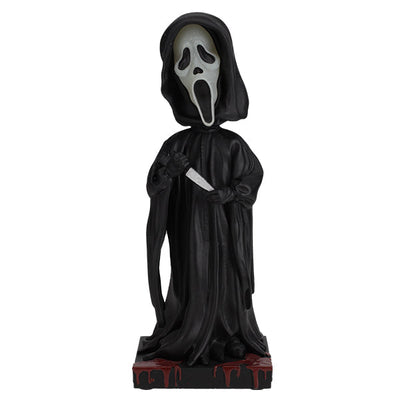 Ghost Face Glow in the Dark Bobblehead featuring the iconic masked character in a detailed design, glowing in a dark setting.