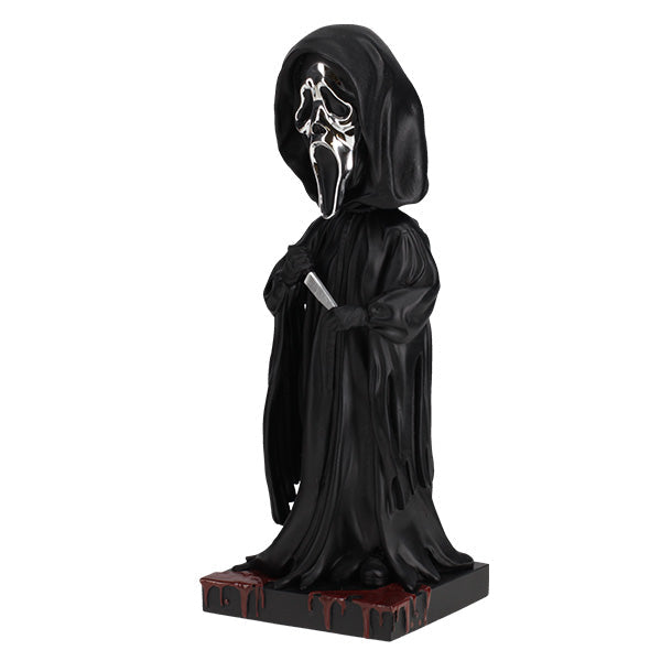 Ghost Face Silver Chrome Mask Bobblehead stands 8 inches tall with a glossy silver finish, showcasing intricate details and features typical of this iconic horror character.