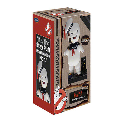 Ghostbusters Classic Stay Puft Scorched Bobblehead standing 8 inches tall on a base designed like a destroyed New York City scene.