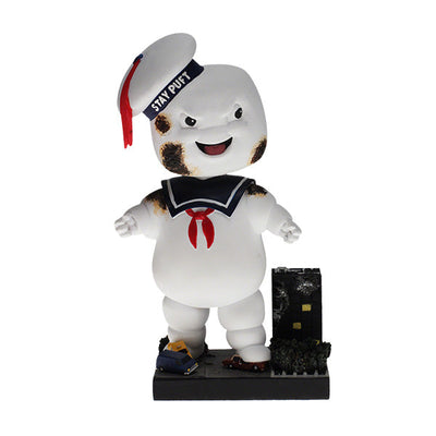 Ghostbusters Classic Stay Puft Scorched Bobblehead standing 8 inches tall on a base designed like a destroyed New York City scene.