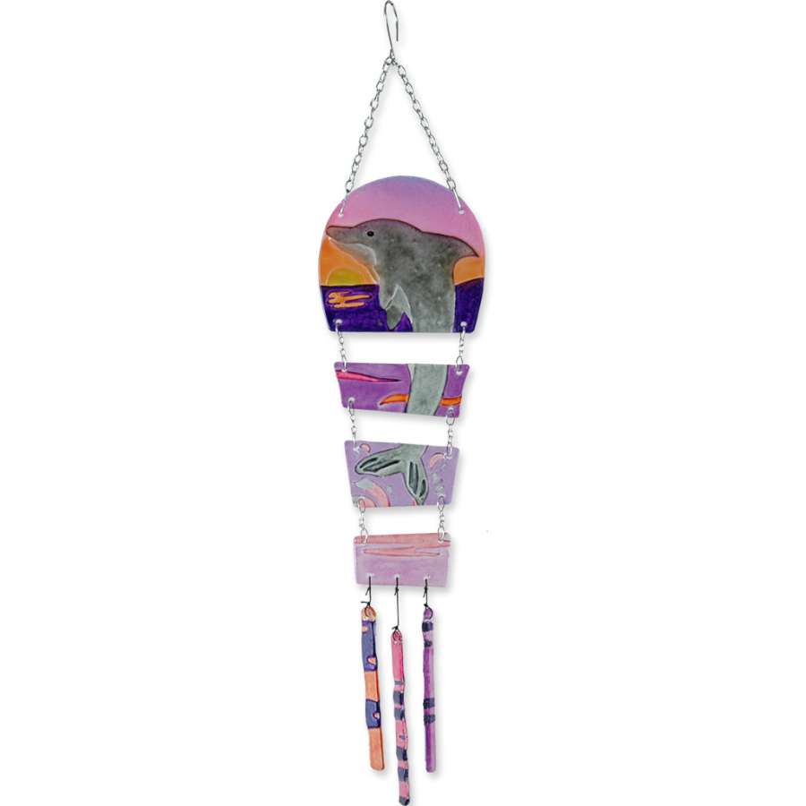 Glass Kite - Sunset Dolphin, showcasing vibrant sunset colors with an elegant dolphin design, hanging to catch sunlight in a garden setting.