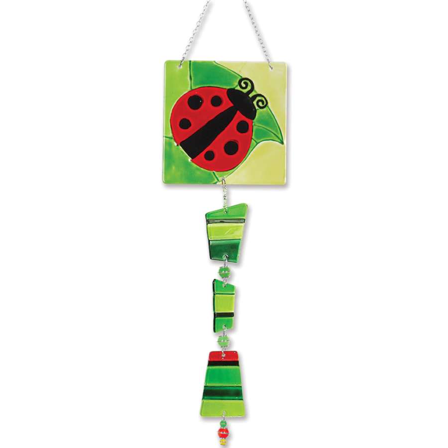 Glass Sun Catcher Mobile with hand-painted ladybug design in colorful kiln-fired glass hanging near a bright window.