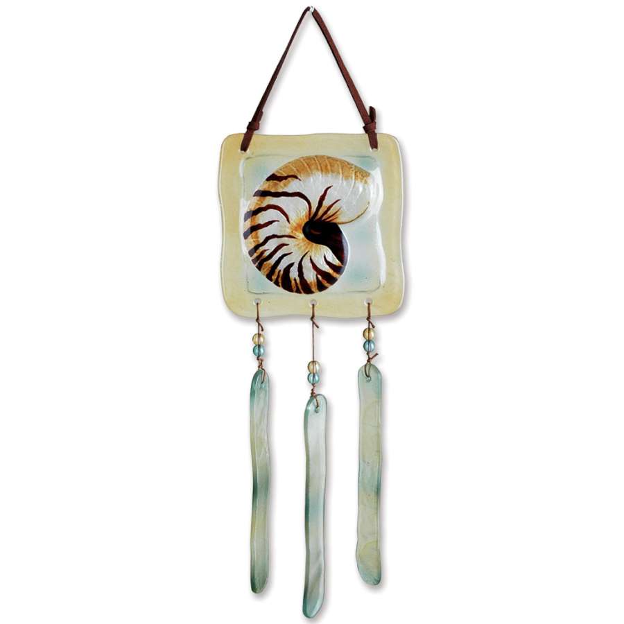 Glass Terra Wind Chime - Nautilus with iridescent finish hanging outdoors, showcasing its unique nautilus shell design and leather strap.