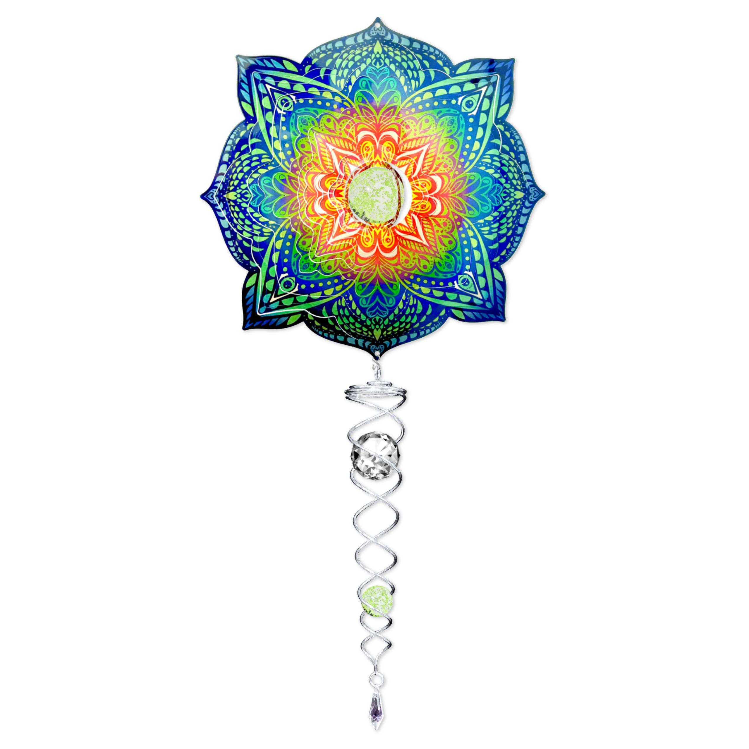 Glow Mandala wind spinner set with a glow-in-the-dark crystal centerpiece hanging outdoors, showcasing vibrant colors and movement.