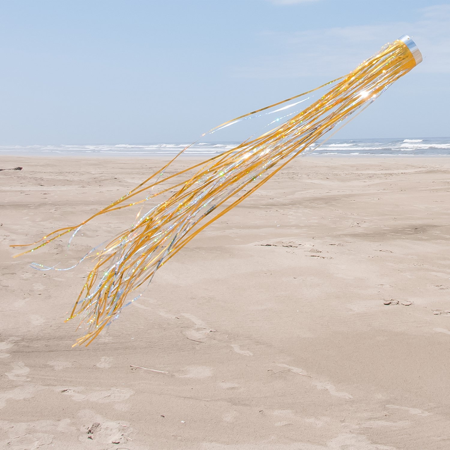 Gold 51-inch Mylar Windsock fluttering in the breeze, showcasing vibrant holographic colors against a clear sky, ideal for garden decorations.