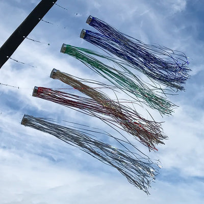 Gold 51-inch Mylar Windsock fluttering in the breeze, showcasing vibrant holographic colors against a clear sky, ideal for garden decorations.