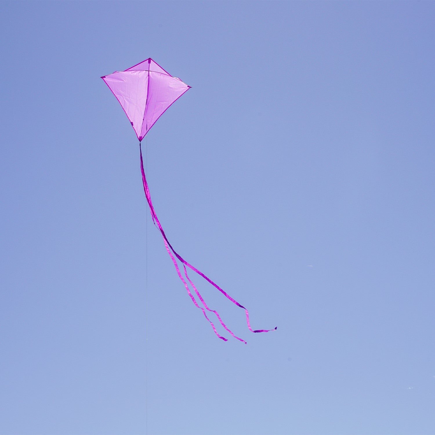 Grape Colorfly 30-inch diamond kite soaring in the sky against a blue backdrop, showcasing its vibrant grape color and stability.