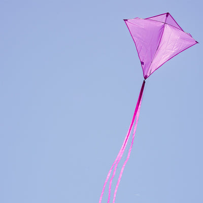 Grape Colorfly 30-inch diamond kite soaring in the sky against a blue backdrop, showcasing its vibrant grape color and stability.