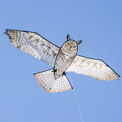 70-inch Great Horned Owl Kite featuring a realistic design with iconic plumicorns and talons soaring against a clear blue sky.