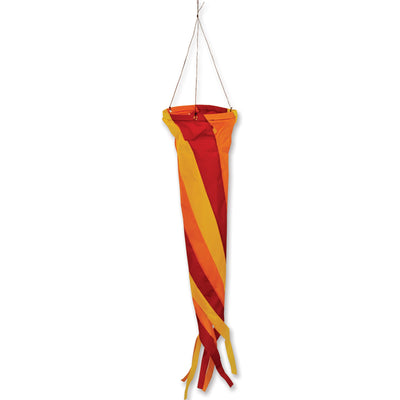 Gyro Delta Kite in Flames flying high against a blue sky with a colorful spinning windsock dancing in the breeze.