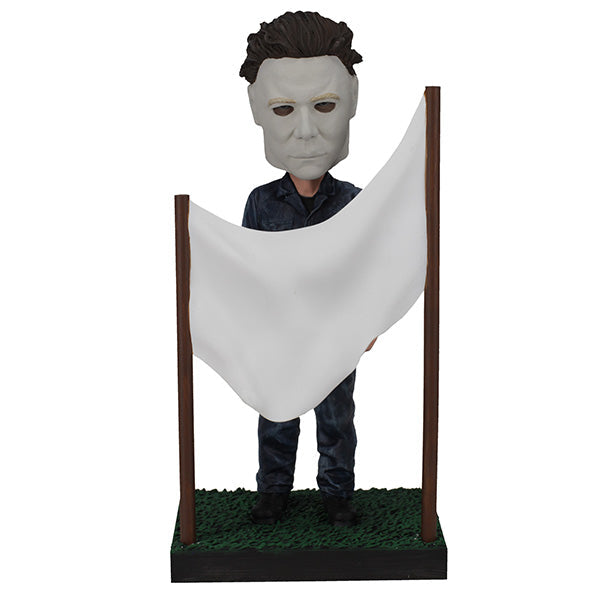 Halloween - Michael Myers in a Clothesline Bobblehead showcasing the iconic horror character mid-action, crafted with premium details on a decorative shelf.