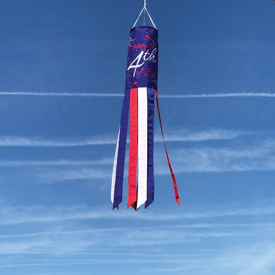 Happy 4th of July 40" Windsock featuring bright red, white, and blue colors, with embroidered details and fluttering tails, hanging outdoors.