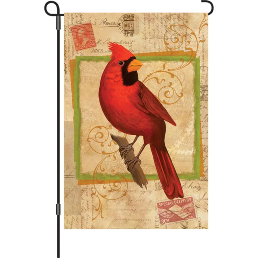 12 in. Happy Cardinal illuminated garden flag featuring a cheerful cardinal design, displayed outdoors in a garden setting.