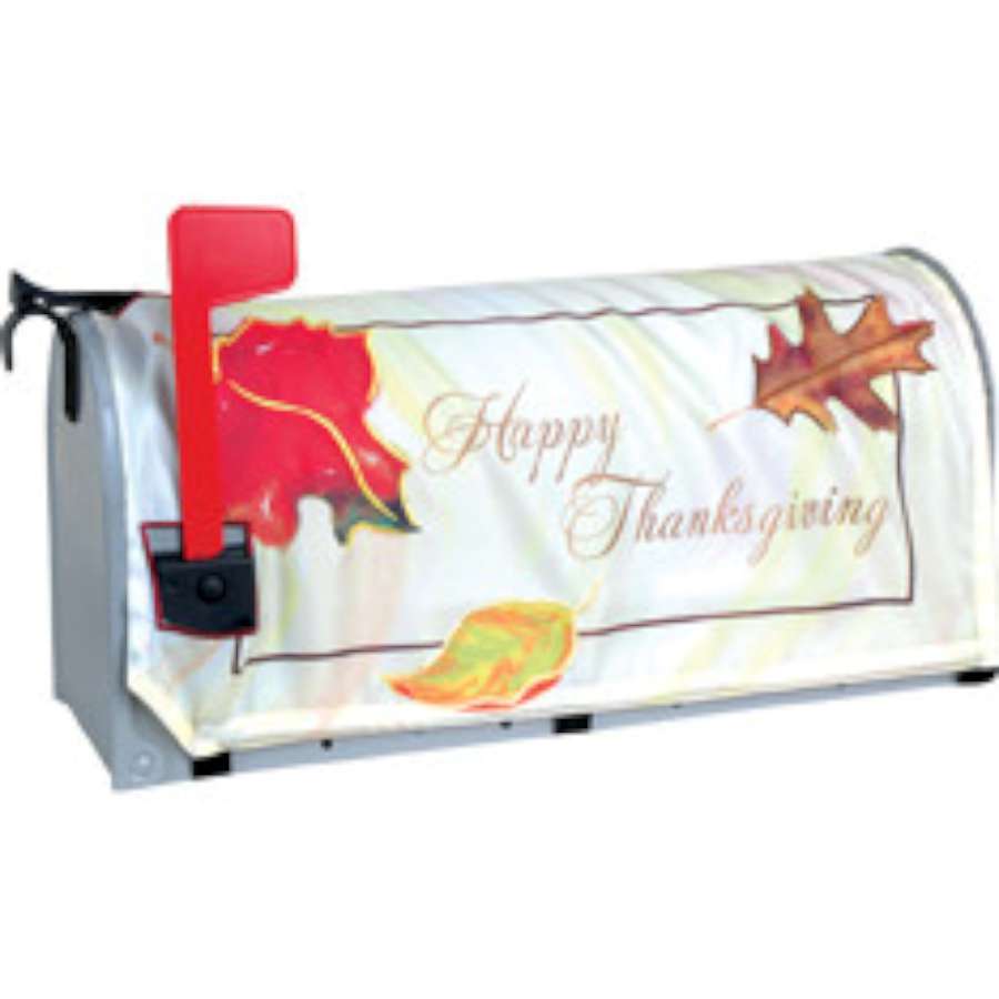 Colorful Happy Thanksgiving mailbox cover featuring festive autumn designs, fitted on a standard U.S. mailbox in a welcoming outdoor setting.