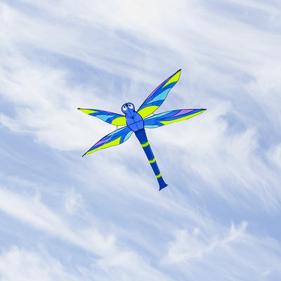 Vibrant Harmony Dragonfly Kite soaring through a clear blue sky, showcasing intricate details and fluttering wings in the wind.