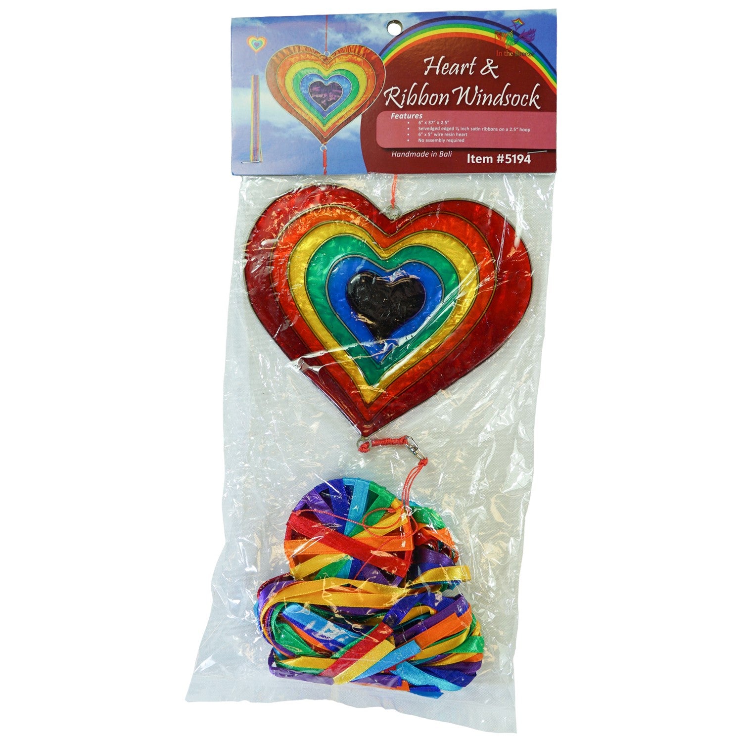 Heart & Ribbon Windsock featuring colorful rainbow satin ribbons cascading from a resin heart ornament, gently swaying in a garden setting.