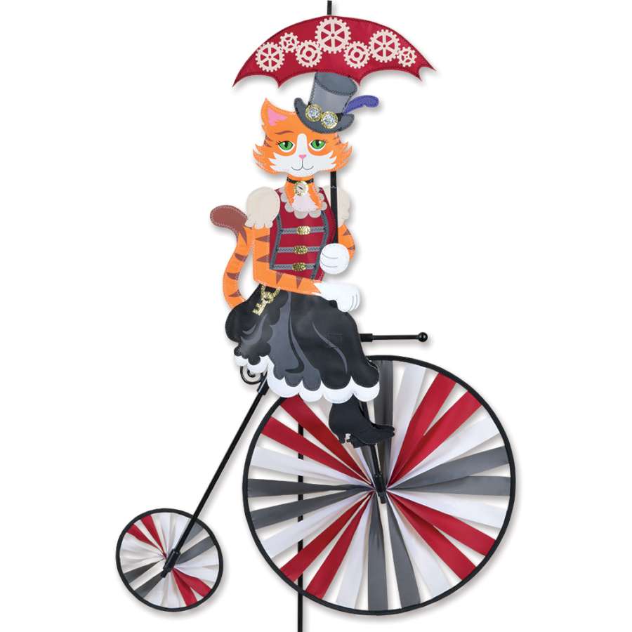 High Wheel Bike Spinner featuring a steampunk cat design spinning gracefully in an outdoor garden setting, highlighting its vibrant colors and detail.