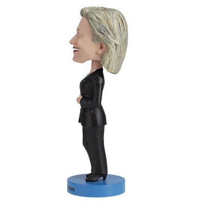 Hillary Clinton 2016 bobblehead, standing approximately 8 inches tall, capturing her likeness in vibrant detail, displayed on a shelf.