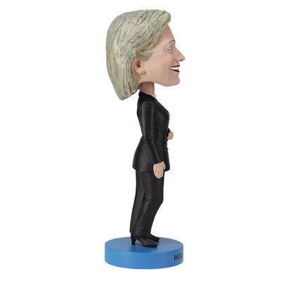 Hillary Clinton 2016 bobblehead, standing approximately 8 inches tall, capturing her likeness in vibrant detail, displayed on a shelf.